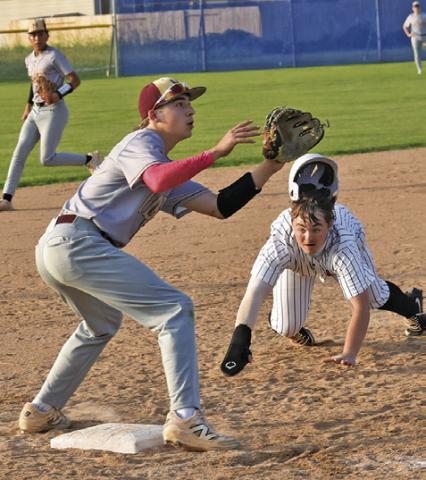 SOMERVILLE’S LUKE MOSES gets ready to slide into third base last Friday in the Yeguas’ season finale against Milano. Tribune photo by Roy Sanders