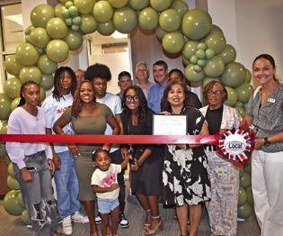 THE RIBBON IS cut on July 23 at the open house for the Somerville Family Practice Clinic. The ribbon cutting and open house was well attended. Cutting the ribbon is Rochelle Adams, and Susan Mott of the Burleson County Chamber of Commerce is next to her. See story inside.
