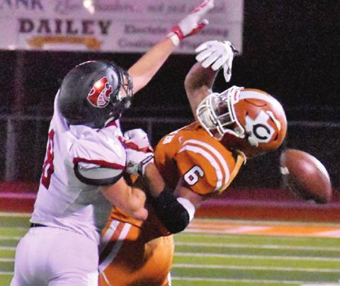CALDWELL’S TRE BURNS and this Lorena defender fight for the ball in last Friday night’s game. -- Tribune photo by Roy Sanders