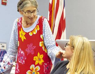 BURLESON COUNTY Democrat Linda Adair welcomes US Congressional candidate Theresa Boisseau during a dinner on Thursday. Tribune photo by Denise Squier