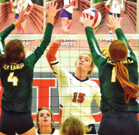 THE NUMBER 2 LEXINGTON Lady Eagles dominated the net play last Tuesday night, defeating the Lady Hornets at home. Pictured are Lexington’s Riley Stamport and Kenzie Muhl attempting to block a hit by Caldwell’s Elizabeth See. -- Tribune photo by Miranda Jones
