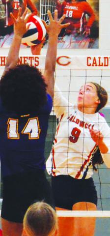 NATALIE EASTEPP challenges La Grange’s Tori Harold at the net during Caldwell’s district loss to the Lady Leps last week.