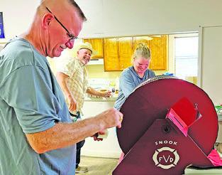 THE SNOOK VOLUNTEER Fire Department also held a raffle during their barbecue dinner fundraiser on Sunday. Tribune photo by Denise Squier