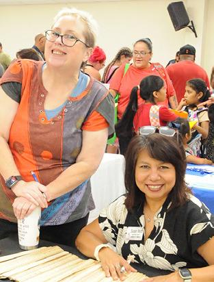 THE BURLESON COUNTY Chamber of Commerce was on hand passing out rulers to area students at Monday’s “Back-to-School Blast.” Pictured are Mollie Marsh and Susan Mott. Tribune photo by Denise Squier