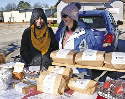 DENNILLE KNOWLTON and Joslyn display Dannille’s Bread on Saturday, Jan. 11, at the farmers market in downtown Caldwell.
