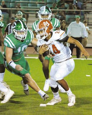 ADIAN TORRES of Caldwell carries the ball against Cuero in the Hornets loss last Friday.