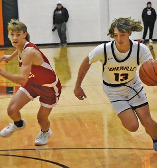 TANNER MOORE OF Somerville dribbles the ball against Burton. Tribune photo by Roy Sanders
