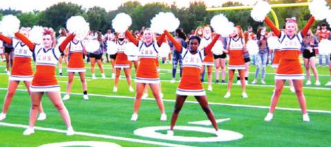 CALDWELL HIGH SCHOOL’S CHEERLEADERS perform for the crowd during Meet the Hornets on Monday night at Hornet Field. -- Tribune photo by Roy Sanders
