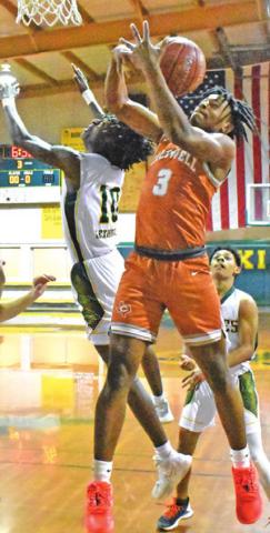 TRE BURNS of Caldwell reaches for the ball in the Friday game at Lexington.