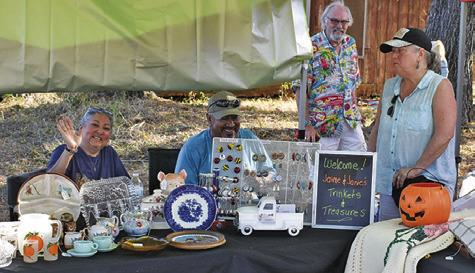 VENDORS ENJOY GREETING visitors at the Yellow Prairie Market on Saturday, Oct. 18, in downtown Chriesman.