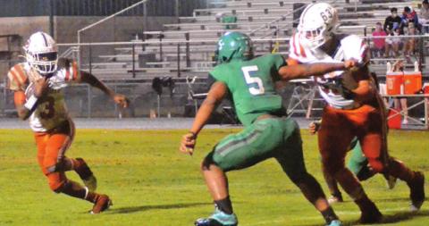 DONTAVIEN JOHNSON BREAKS free as Ryan Broaddus blocks in the Hornets’ victory.