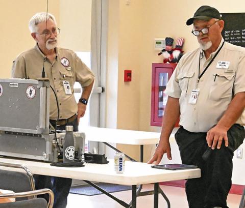 MEMBERS OF LEE COUNTY Amateur Radio Emergency Services (ARES) visited with the Burleson County Community Emergency Response Team (CERT) last Tuesday. CERT is looking at trying to get a grant to set up radio emergency services in Burleson County. Tribune photo by Denise Squier