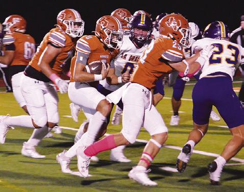 CALDWELL QUARTERBACK COY Becka carries the ball against La Grange in last Friday’s game. -- Tribune photo by Roy Sanders