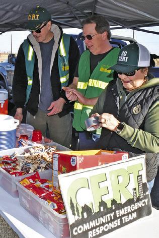CALDWELL’S CERT Team works at their station on Saturday morning during the area firefighters defensive driving course. They include, from left, Steve Weismuller, Jeff Buck and Polly Bowers.
