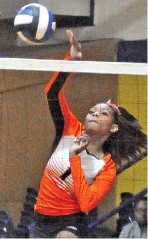 XADRIA MARTIN HITS hits the ball over the net during Somerville’s win over Dime Box on Friday. -- Tribune photo by Roy Sanders