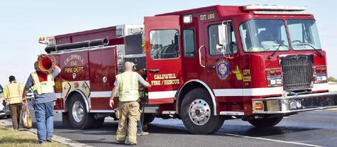 CALDWELL VOLUNTEER FIREFIGHTERS respond last Sunday afternoon, Dec. 1, at this traffic accident off State Highway 21 East near F.M. 2000.