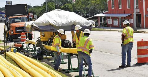 CREWS WORK ON the new Atmos gas line installation project on Monday off State Highway 21.