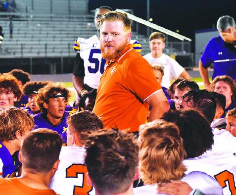 BOONE PATTERSON ADDRESSES Caldwell and La Grange players after the La Grange game. -- Tribune photo by Roy Sanders