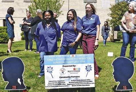 BARBARA VINCENT, FELISHA Tapia and Jodi Olive of the Burleson Health Resource Center stand behind the sign at the ceremony.