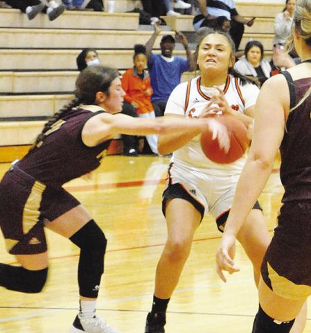 VIVIANA MUNOZ FIGHTS to maintain posession of the ball during the Somerville-Milano game last Friday night in Somerville.