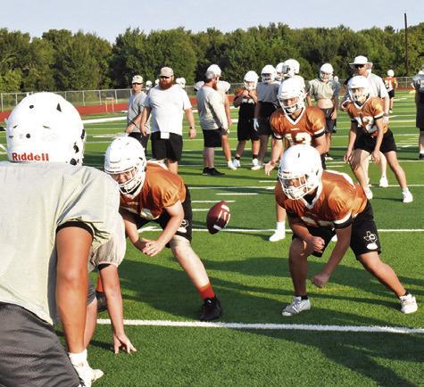 THE CALDWELL HORNETS work on their offensive plays in this practice session. -- Tribune photo by Roy Sanders