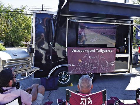 TAILGATERS ENJOY THIS spot on Saturday during the “Toasting at the ‘Well” beer and wine walk in downtown Caldwell.