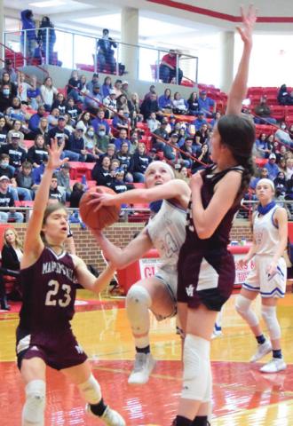 SNOOK’S JAYCIE BRISCO is about to be fouled by Martin’s Mill’s Libby Rogers during the UIL Class 2A State Semifinal game on Saturday. Also defending is Jada Celsur. -- Tribune photo by Denise Squier
