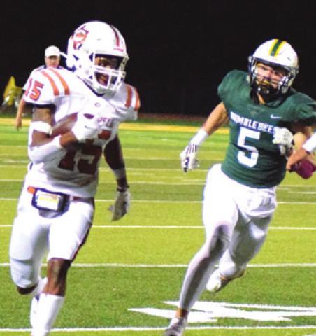 CALDWELL’S LARRY DAVIS gets away from Bumblebee defender Scout Brazeal during the Hornets’ loss to Little River Academy Friday night. -- Tribune photo by Denise Hornaday
