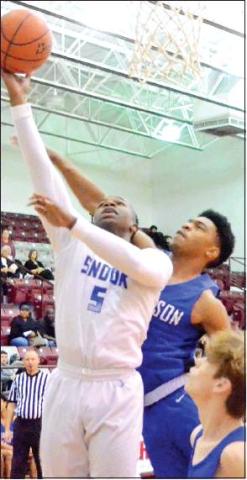 QWAN YOUNG of Snook takes a shot against Robinson at the Cameron Tournament. The Bluejays held on to win 56-48.