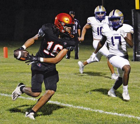 GARDNER SHIVERS OF Somerville makes this catch and rushes to the end zone for a two-point conversion against Louise.