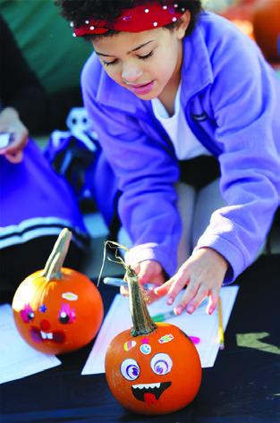 CALDWELL SECOND-GRADERS and their families enjoyed decorating pumpkins during the elementary school’s “Parents &amp; Pumpkins” event last Friday morning.