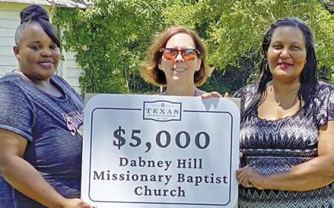LANE TRANSOU of the Texas Historical Foundation presents the grant award. Also pictured are, left, Jamonica Jackson and, right, Sharon Prejean.