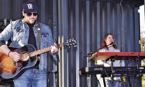 FORGED IN FAITH WAS ONE OF the bands which performed during the “Christmas at Welch Park Music Festival” in Somerville. Pictured, from left, Coleman Wiederhold and Denise Squier. Tribune photo by Roy Sanders