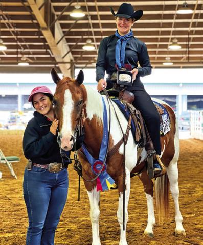 SABINE LAZO IS PICTURED WITH her horse, Heza Hugable Jet, and exhibitor Haven Hundl of College Station after their first win. Photo courtesy of Lazo Performance Horses