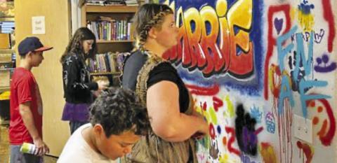 TEENAGE READERS AT THE Harrie P. Woodson Memorial Library showcased their art skills on the library’s “Graffiti Wall.”