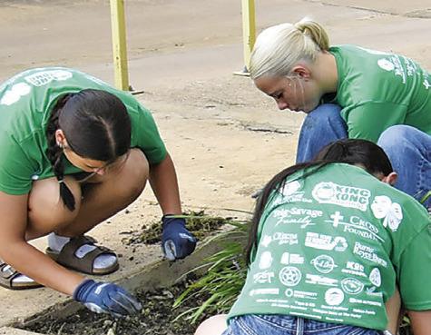 CALDWELL JUNIOR HIGH School students participate in the Big Event service project on Friday, May 15. The students worked on flower beds for this portion at the Caldwell Police Station.