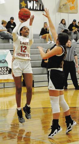 CALDWELL’S TYNIAH JOHNSON shoots the ball over a Bruceville-Eddy player during the Lady Hornets’ game against the Lady Eagles last Monday at Hornet Gym. -- Tribune photo by Denise Squier
