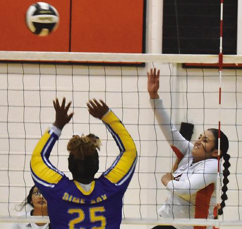 SOMERVILLE’S VIVIANNA MUNOZ hits the ball over a Dime Box blocker during the Lady Yeguas’ win last Friday. Tribune photo by Roy Sanders