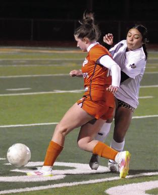 ADELINE HICKS DRIBBLES down the field during the Caldwell-Giddings game last Friday night. Giddings won the game 4-1. Tribune photo by Denise Squier