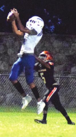 ANDERSON-SHIRO’S Ca’Darrius Williams leaps for the catch while Somerville’s Verkobe Woodberry tries to make a defensive play Friday. -- Tribune photo by Denise Hornaday