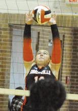 HADLEY HOWE pushes the ball over the net for a point against Hearne during the Somerville Volleyball Tournament on Saturday. Tribune photo by Denise Squier