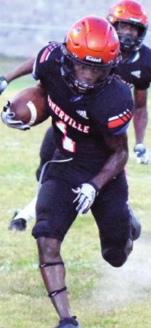 SOMERVILLE’S HERSCHEL Conway kicks up dust as he runs for positive yards during the Yeguas’ home game against Alpha Omega Academy. -- Tribune photo by Denise Squier