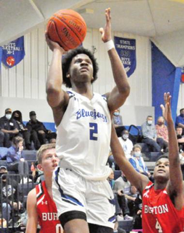 JERMAINE KEARNEY of Snook shoots against Burton. Snook won 44-40.