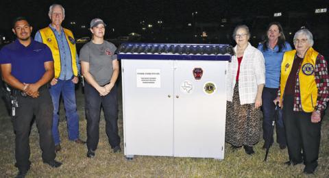 THE FOOD PANTRY IS placed at the Snook Volunteer Fire Department. Pictured are, from left, Burleson County SRO Officer Steven Guerrero, Steve Tunnell of the Lions Club, Beth Collins of Snook Volunteer Fire Department, Ann Sebesta of Snook EEA, Cindy Jarrott of Snook EEA and Lydia Faust of Snook EEA and the Lions Club.