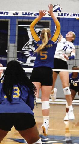 MABRY PRIHODA attempts to get the ball past a Dime Box player during the Snook-Dime Box match last Friday afternoon. Tribune photo by Denise Squier