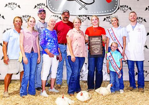 ADDISON HOLCOMB exhibited the Grand Champion Market Broilers at the 2026 Burleson County Fair. She is pictured with Jay Malazzo, Daley Holcomb, Chandler Malazzo, Jeaniene Malazzo, Zack Holcomb, Jill Holcomb, Fair Queen Jolee Telschow, Little Miss Irene Kovar and Jacob Price. Photo courtesy of Jessica Jeffries/Jeffries Livestock Marketing