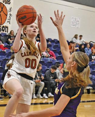 IRELAND MORGAN shoots over a La Grange player during the Caldwell-La Grange game last Friday night at Hornet Gym. Tribune photo by Roy Sanders