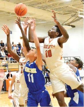 DONOVAN JABBAR of Caldwell leaps high for this rebound against Dime Box last Tuesday in Caldwell. The Hornets won 45-44.
