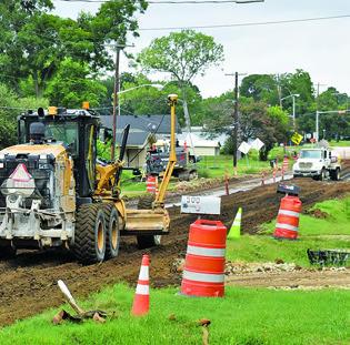 WORK CONTINUES ON F.M. 975 in Caldwell. Texas Materials Group is working on this TxDOT project to rehabilitate the road, redo the curb and gutter and upgrade drainage. Work is being done from State Highway 21 West to the railroad overpass. Completion is set for the spring of 2026.