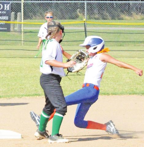 HARLOW FERGUSON slides safely into second during the team’s tournament game against Washington County last Saturday.